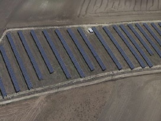 Aerial view of solar panel rows